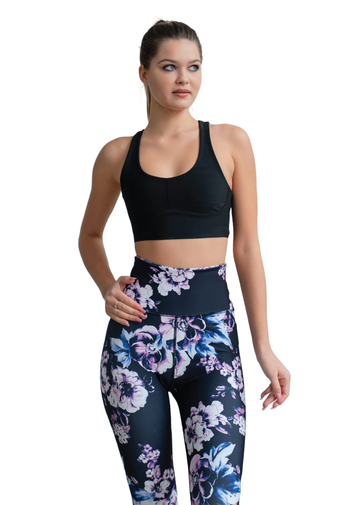 Person in einem schwarzen Sportoberteil und Lismina 334 High Waist Leggings in Schwarz, Blau, Rosa geblumt posiert seitlich.